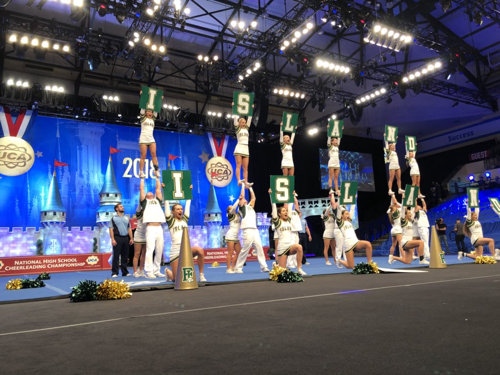 UCAupdates's tweet photo. Fleming Island Medium Varsity Coed had the entire crowd on their feet yelling for the green and gold! #UCAnationals https://t.co/dm1l6d2Gsb