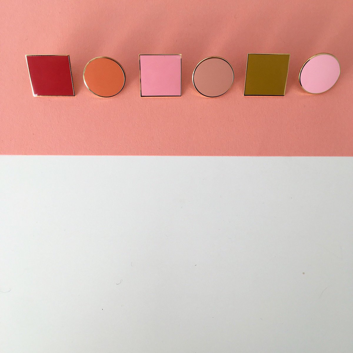 Circles and squares in pinks, deep red, rust and mustard! All available at plainpins.com
