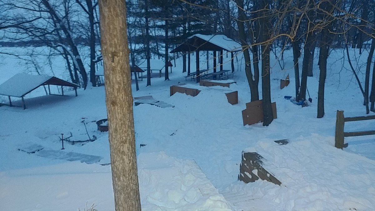 These boxes in the snow are our sleeping shelters for the weekend.