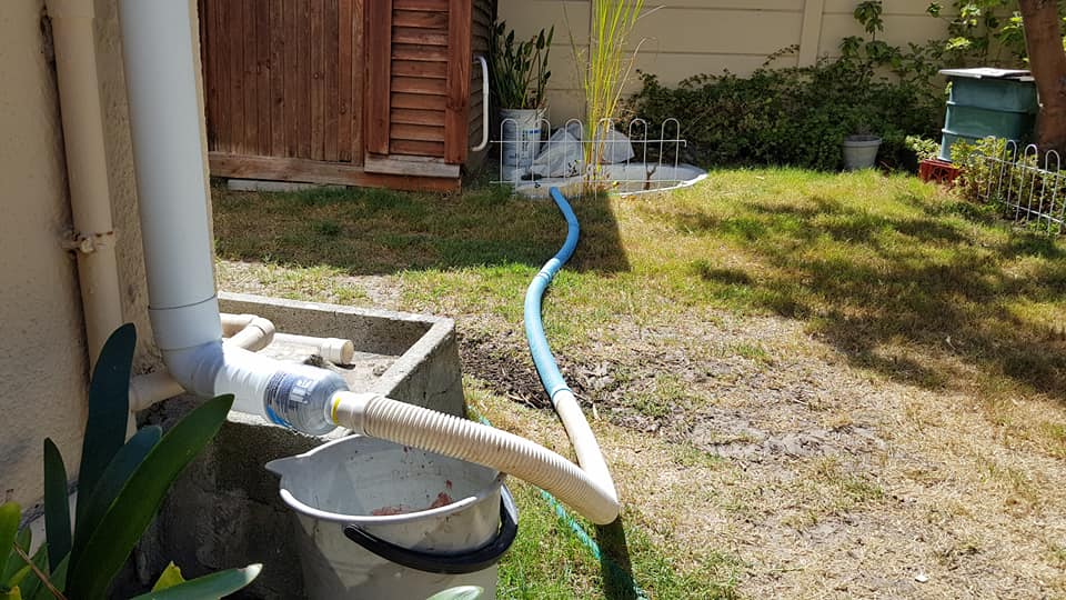 sbrittan13's tweet photo. I came up with this to keep my fish alive during the #CapeTownWaterCrisis. I cut off the bottom of an Energade bottle &amp; it was a perfect fit for the gutter &amp; pool pipes! I've added a filter to remove gutter gunk made from a vegetable bag. #News24WaterTips #DefeatDayZero #DayZero https://t.co/8ccfzbM3Ao