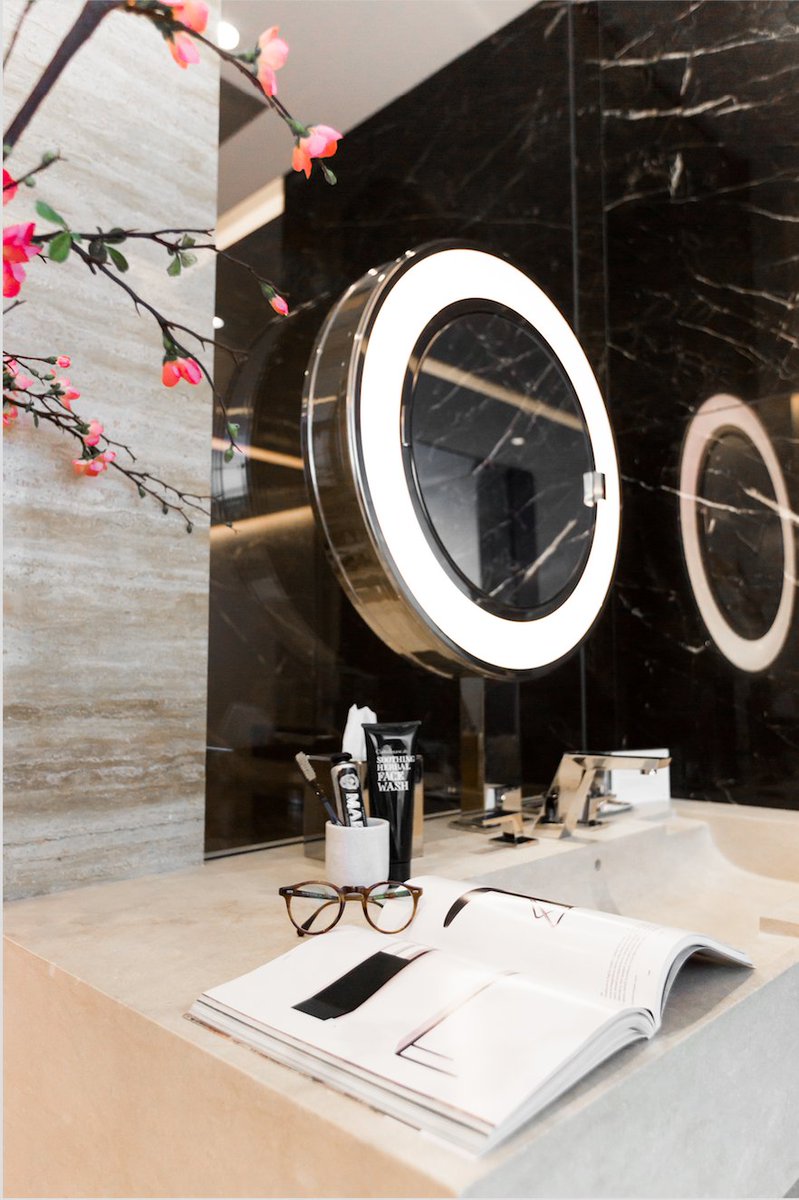 Perfect your grooming routine at #53W53, where bathrooms feature carved Verona limestone sinks and custom mirrors.