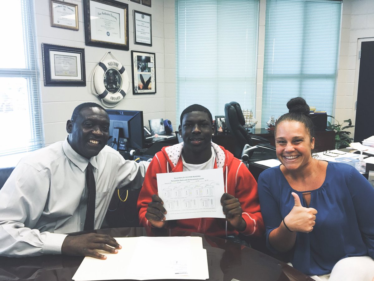 LeeSuccessAcad's tweet photo. Mr. Bowens and Ms. Dohme celebrating student success. This student set a goal and reached it. We are so proud of him!! #bucketjumper #datafolders https://t.co/gFEpeK6rOu