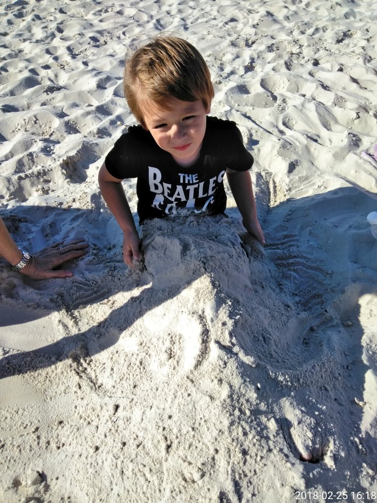 Christi89366124's tweet photo. Cody getting buried in the sand 🏖️ https://t.co/2iH1YT1nPN
