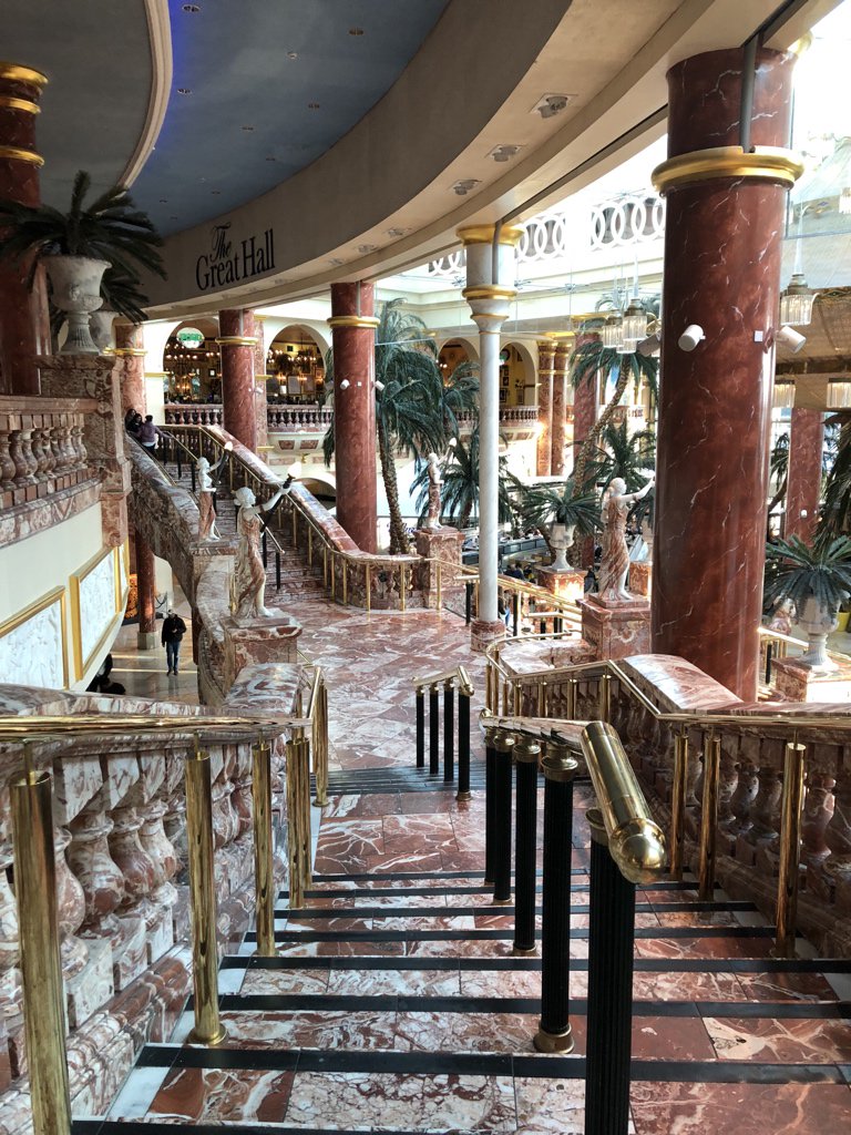 Behind the food court is the Great Hall. Look at this gigantic chandelier. Observe the Five Guys in the background.  #NinjiAtTheTC