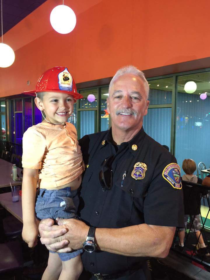 SBCOUNTYFIRE's tweet photo. Fire Marshal Mike Horton surprises Levi Michael Holmquist on his bday. 6 yrs ago Horton helped deliver Levi on the side of the 215 frwy. Happy Birthday Levi!#futureFF #duty #honor #community @dfmfm1_mike https://t.co/FjQCdlssv1