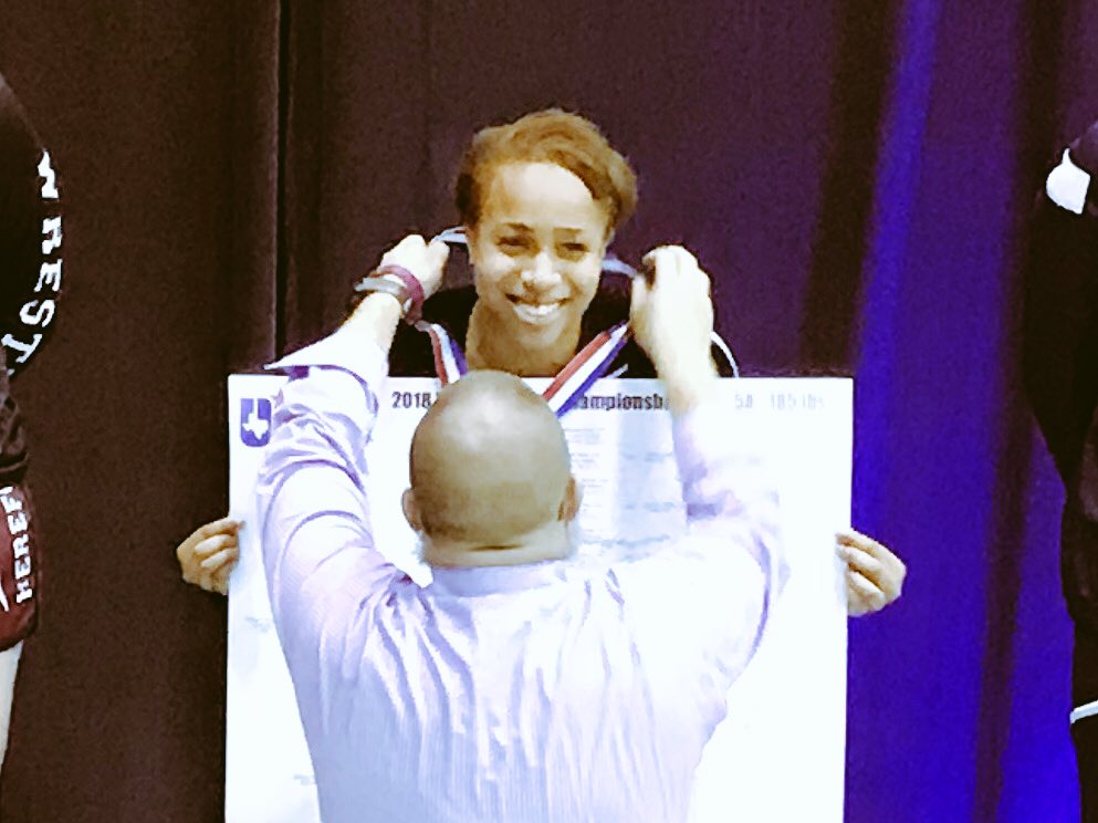 Humble_Wrestle's tweet photo. Eloni Sowell is all smiles and Coach Kimes shows his best side for the camera. Gold medal makes me smile 😊 #hhspurplepride https://t.co/q8JnsvsIQN