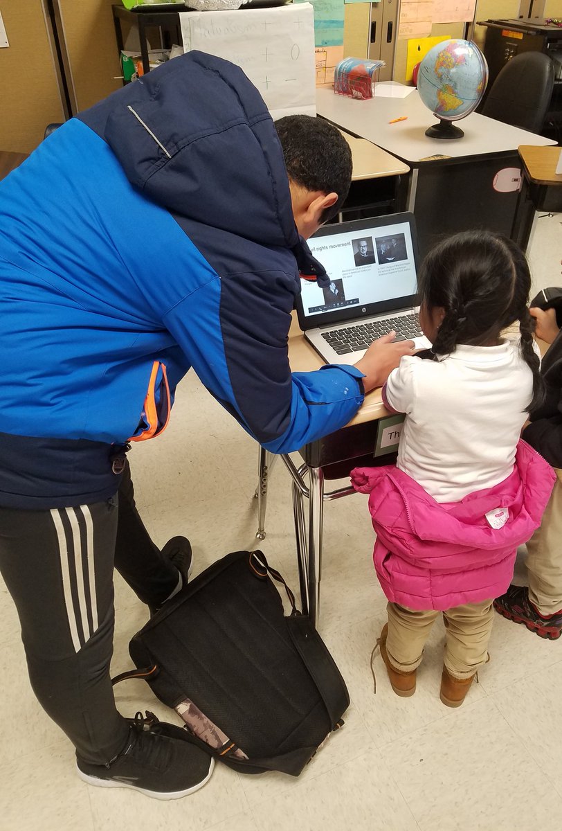 NBPSFoster's tweet photo. One of our middle school students teaches a younger student about Thurgood Marshall during Woodrow Wilson's Black History Month Living Museum. #allinfornb https://t.co/J36nt00ssf