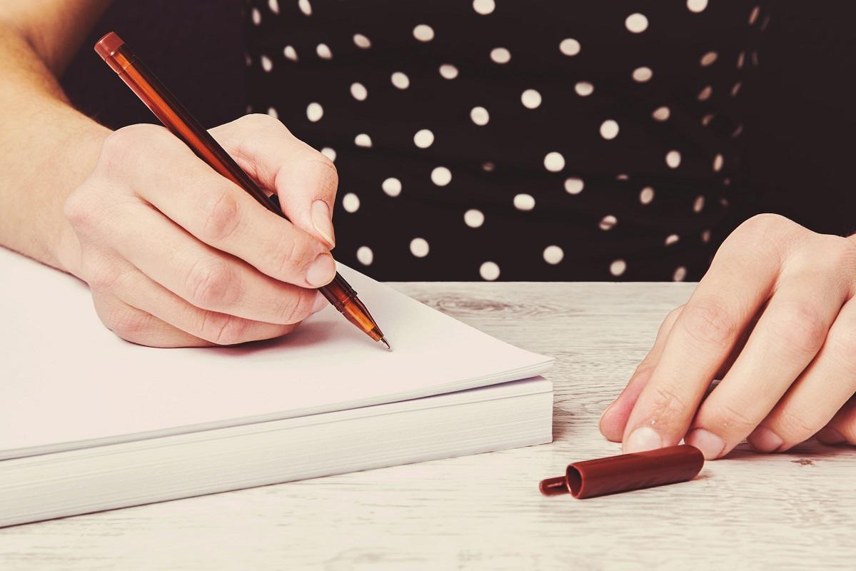 Writing something. Man writing notes. Что записать в блокнот. Рука с ручкой. Женщина пишет в красном блокноте.