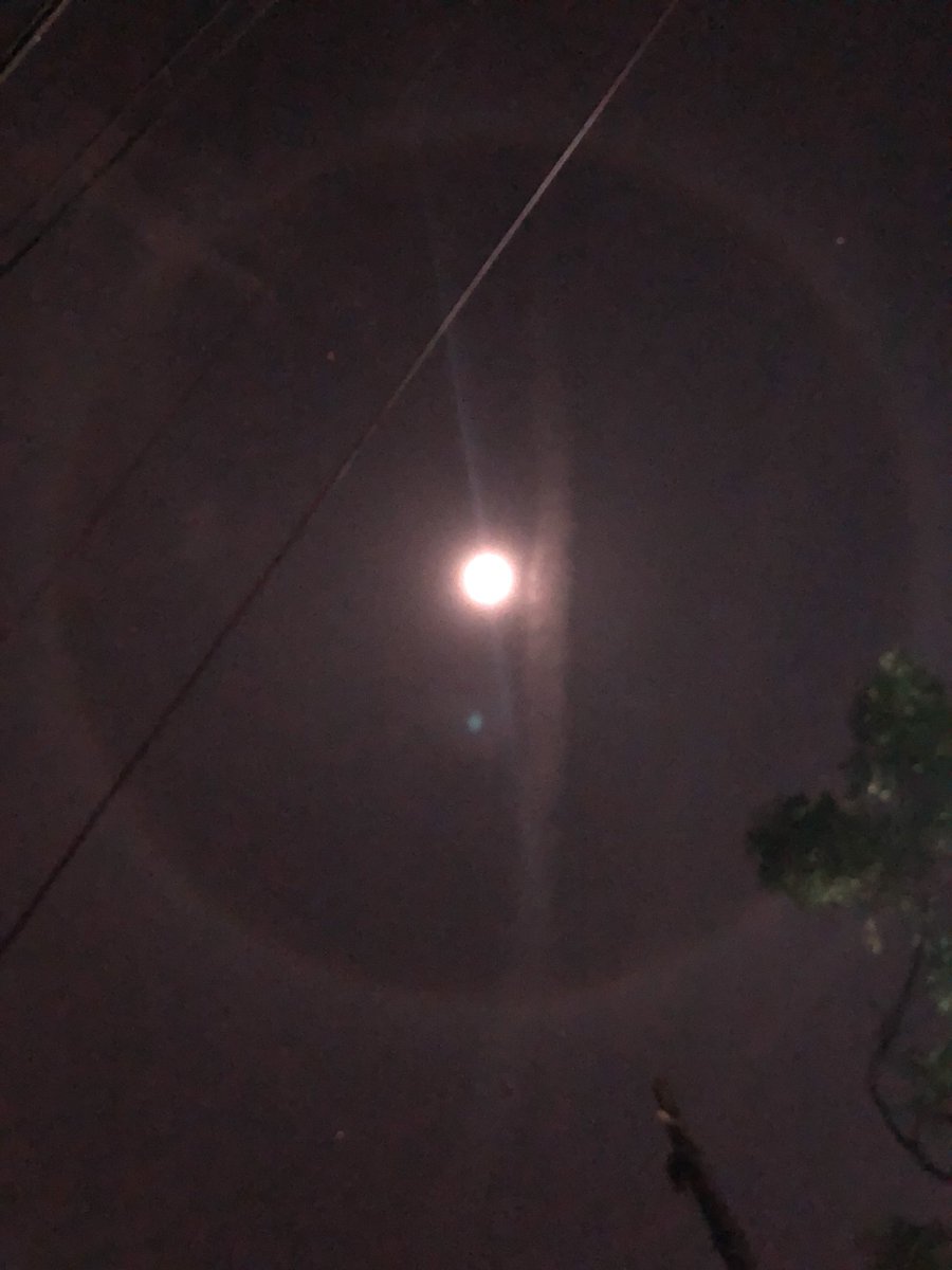jdv_38's tweet photo. Are you guys seeing the moon with clouds in a circle around it with a line through it?!!!!!!! https://t.co/z7ra9fqPSE