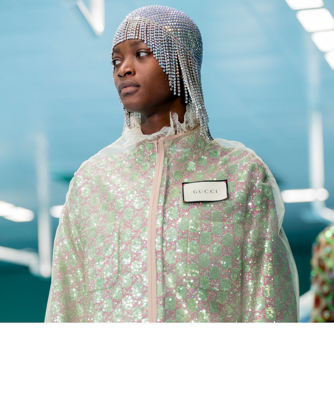 gucci on X Textured layers in the GucciFW18 collection by AlessandroMichele a jacket with all over sequin and crystal GG motif embroideries and nylon tulle crew neck cape with Gucci tag on the front