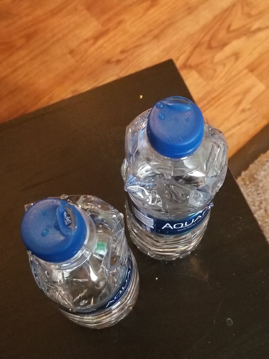 SRMelinski's tweet photo. Can you explain to me why the lid on these 2 from our 32 pack are melted when we pulled them out of case @Aquafina https://t.co/220oRnMU7u