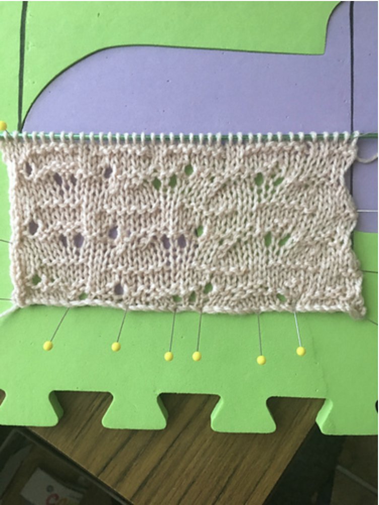 this is an elegant and subtle textural pattern with asymmetrical eyelets and a gently scalloped right edge