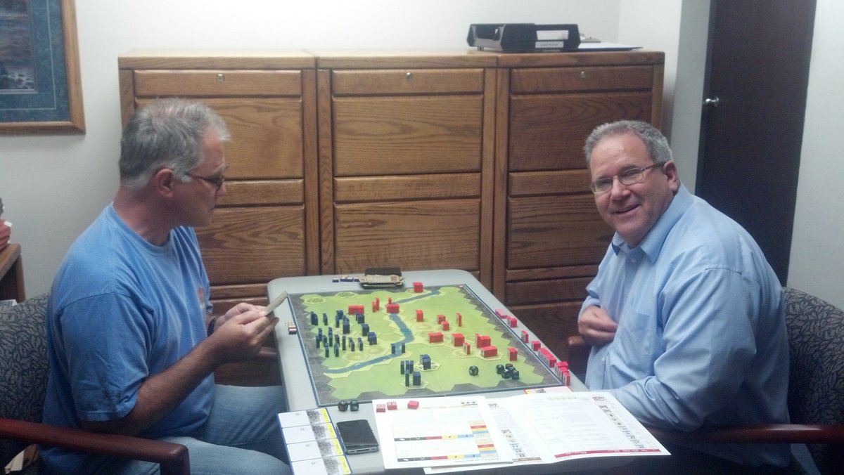 BoardGameBloke's tweet photo. #OTD in 2014. Greg (r) and Klassy Kevin (l) playing Command &amp; Colors Napoleonics at the #VCSB Newbury Park #Meetup . Greg watches Klassy Kevin do his signature chin rub pose. Then Greg hams it up himself. Of course I was playing #BattlestarGalactica #boardgames @gmtgames https://t.co/wtWlqdfYsJ