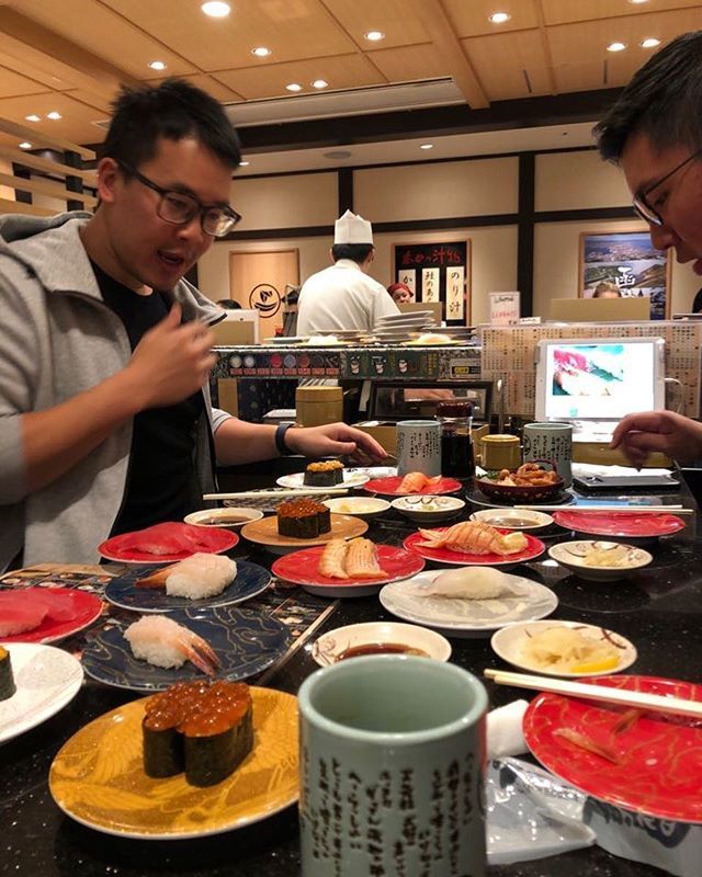 tim_ong's tweet photo. When you’re like a fat kid in a candy shop but it’s actually a sushi shop. In seconds our table is full of goodness! Throwback to our last meal in Japan!  #sushi #japan #goodfood #hokkaido #family https://t.co/S6gH8fghMJ https://t.co/2KfDuoLcW2