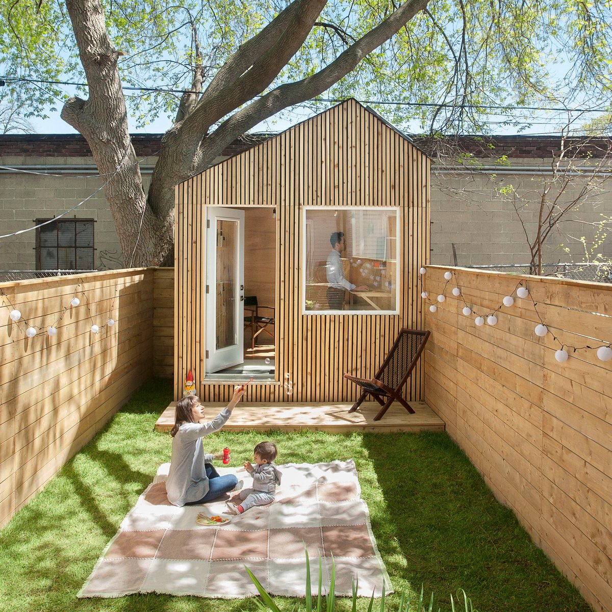 dezeen's tweet photo. The founder of architecture firm Six Four Five A has constructed a tiny timber workspace for himself at the end of his garden: https://t.co/pIXzZX2fb0 https://t.co/gw5A8fgAR6