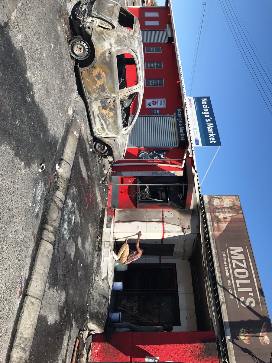 AthiMtongana's tweet photo. Mop up operations at one of Cape Town's well known tshisanyama hang out spots, Mzoli's in Gugulethu. Residents have been protesting over housing. #GugsProtest https://t.co/kyPgQkSALe