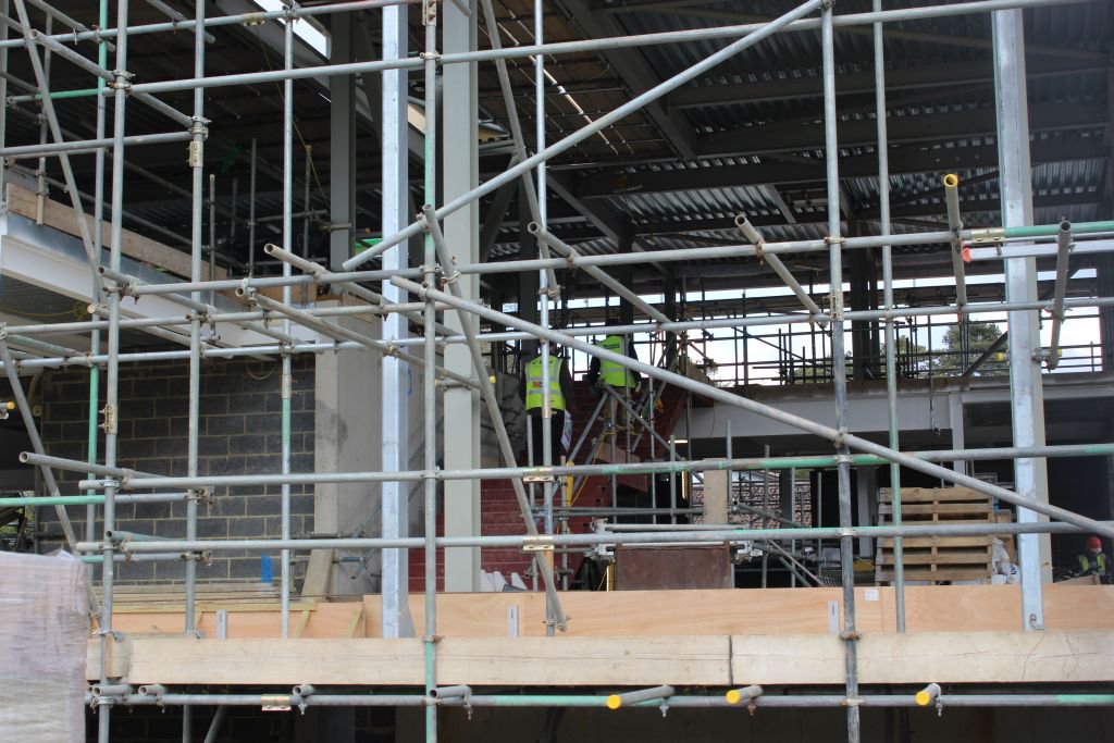 DowneHouse's tweet photo. It's a hive of activity on the #CentreforLearning building site - the parapet is in place, the main staircase installed, the external and internal walls growing day by day, the final layer of the roof covering being laid and the first fix has started #innovation #progress #GoDH https://t.co/aC67aZCRi1