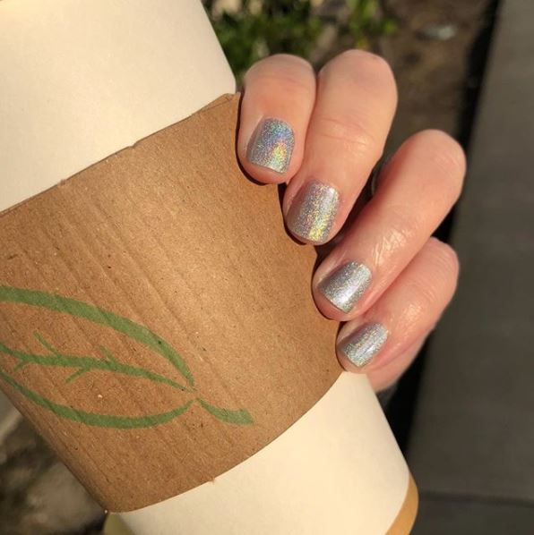 When your Liquid Bling nails are holding your liquid lover, coffee. Make it a great #ManiMonday! Nails by @vampyvarnish / Color: Liquid Bling #MorganTaylorPlatinum #holographicnails