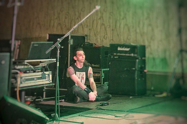 spttmusic's tweet photo. Tyler patiently awaiting his time to rock the stage Saturday night! He got a new rib tattoo recently! #ink #bass #ShePulledTheTrigger #SPTTfam #NewRock #rock #metal #starvingartist #concert #rocklife #READYTOPLAY #art #music https://t.co/JLfvvCA8Gv
