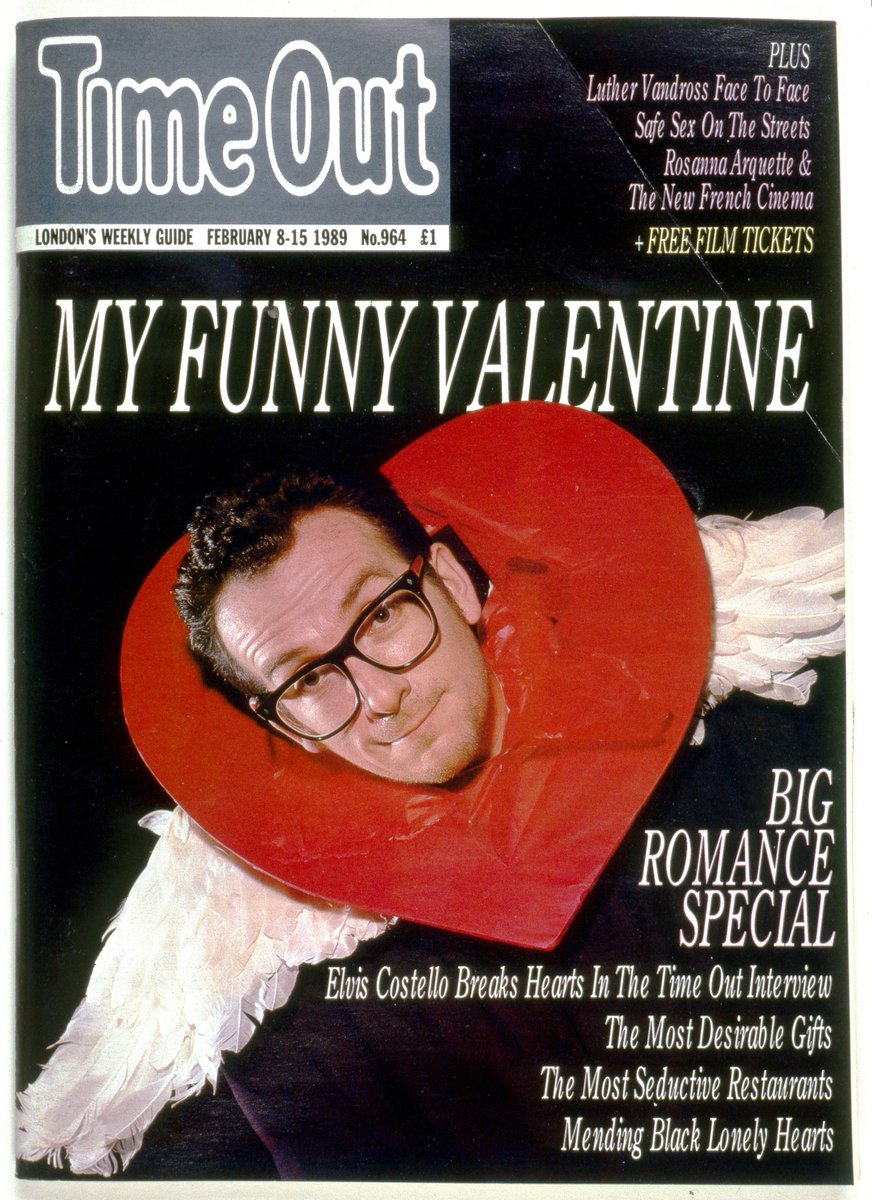TimeOutPics's tweet image. Happy Valentines Day. Here's Elvis Costello bursting through a heart in 1989 to celebrate. #TimeOutArchive @ElvisCostello