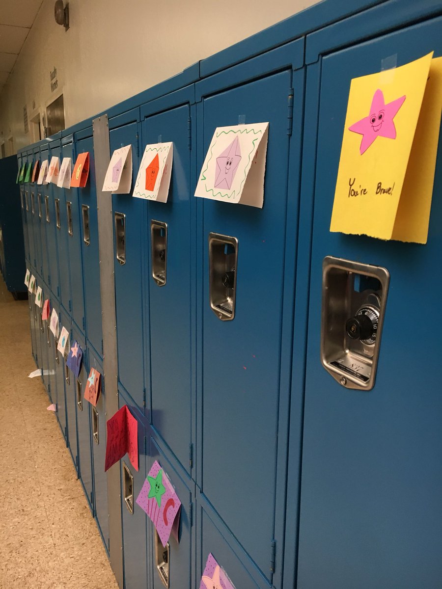 Caught this lady in the act after school today—Ms. Robinson putting a positive note from her service class on each locker#happyvalentinesday