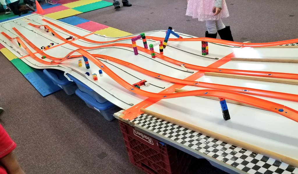 KyleHamstra's tweet photo. So awesome to see the racetrack enhancements they created. Even more amazing when these kinders engineered ways to go "on top of, under, above, below," and through, doing whatever it takes to overcome all obstacles in their paths. #sciKP11 #ddestem #TheGreat5thGrRace https://t.co/2xDke5smDm