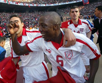 Tunisia's players celebrate their 2004 Africa Cup of Nations triumph.