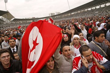 Tunisia fans wave a Tunisian flag on 14 February 2004 at the Charlety's Stadium in Paris, after Tunisia won the African Nations Cup in Tunis with a 2-1 win over African rivals Morocco.