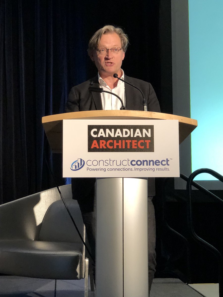 CdnArch's tweet photo. Oliver Lang @ol_lwpac Principal and Creative Director, LWPAC, President, Intelligent City speaking at #BuildexVancouver #viewsfromtheedge keynote session – ‘Disruption’ – on Platforms-For-Life: A Re-Generative Housing Systems Platform Technology https://t.co/sDyH4oahiT