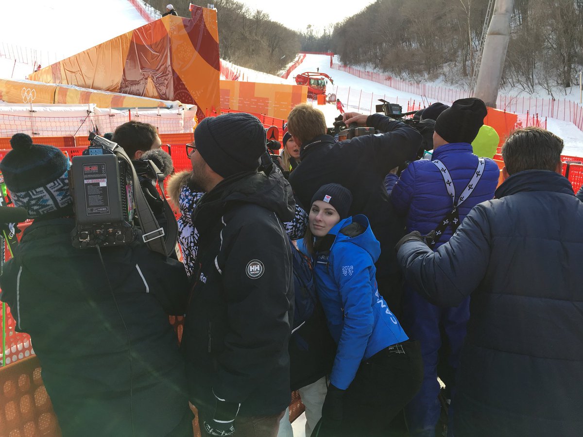 CBCMarie's tweet photo. Media scrum following the gold medal run for @MikaelaShiffrin She’s in there somewhere.  @jackydoorey of #CBC doesn’t look impressed holding the microphone 😀  Congrats!! #PyeongChang2018 @TeamUSA @CBCOlympics @cbcsports @CBCNews #Olympics https://t.co/eqDsaNTJAh
