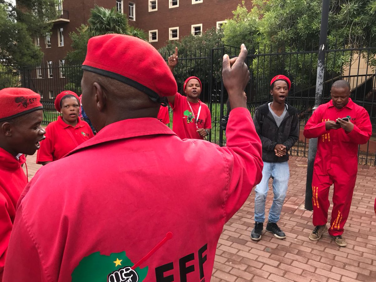 TheStar_news's tweet photo. EFF supporters picketing outside the Bloemfontein Specialised Commercial Crimes Court where #TonyGupta and four others are due to appear. The #Hawks made arrests yesterday over the Vrede farm alleged fraud and corruption. Full story coming. https://t.co/FFPqEGtA5i