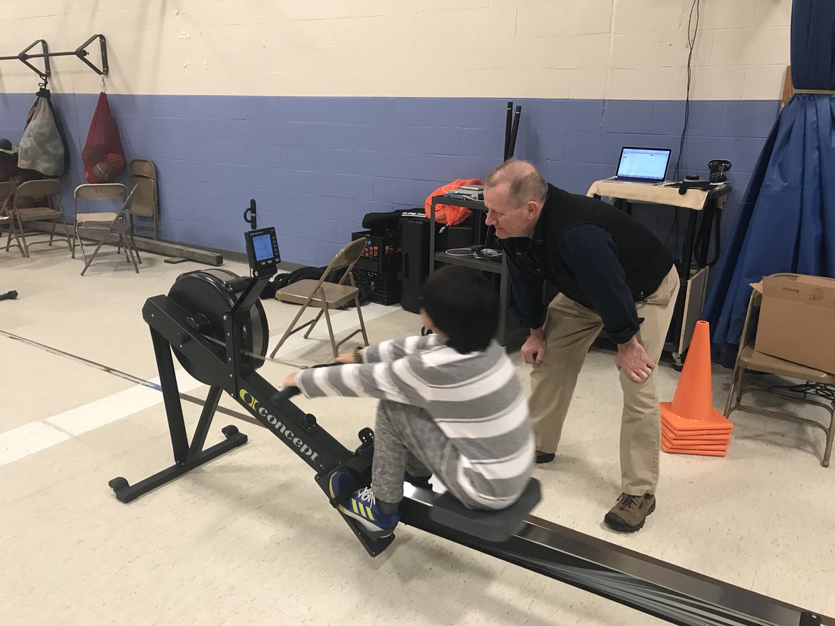 WellnessClass's tweet photo. When your principal says “Buy some Rowers!” Then joins in on the fun and helps teach Ss proper form! #thankful #SupportiveAdmin https://t.co/2Vmpy0qsrT