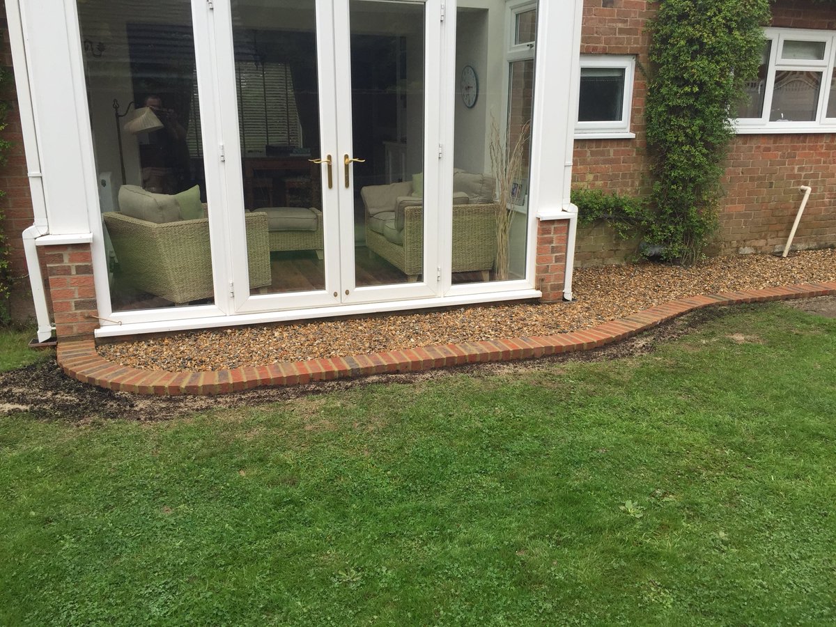 Dgbuilding's tweet photo. Landscaping? No problem. Customer wanted to tidy up part of their garden to make it usable in the summer. Dig out, type 1 MOT. 20mm shingle. Brick border. Job done 👍🏻#landscaping #building #design https://t.co/9z7XZX3SmW