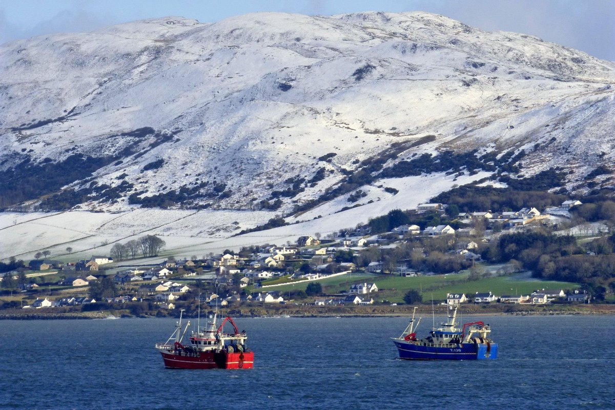 visit_donegal's tweet photo. Fishing boats in Lough Swilly, Co Donegal - with Lisfannon an the hills of #Inishowen in the background https://t.co/b9Z1QEDbNg