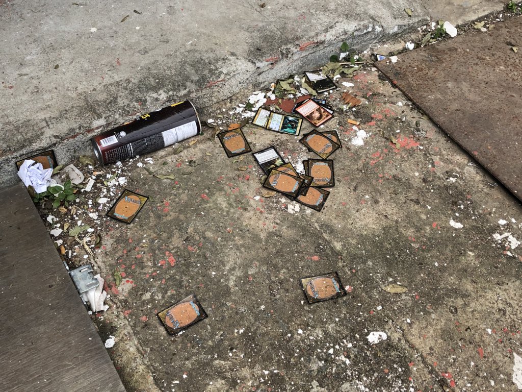 Graveyard of Pringles and MTG cards discarded on the sidewalk a block from  my place. There's a metaphor here somewhere.