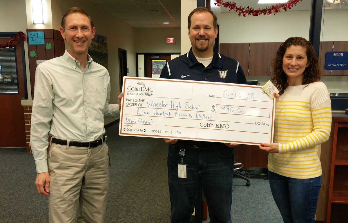 Wheeler_High's tweet photo. Congrats to our Media Center for receiving a grant from Cobb EMC for poster maker for the school! Mark Justice from Cobb EMC came out today to surprise and present the check!! https://t.co/7X6EEsNrUH
