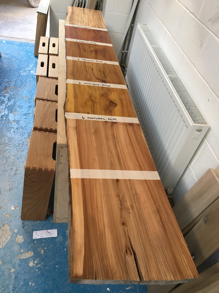 Nice board of elm in our polishing room with various stains applied ready for clients final choosing #bespokekitchens