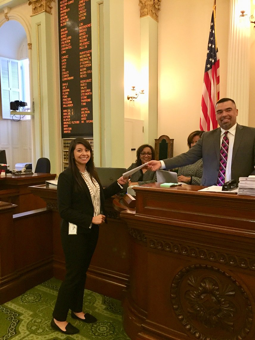 WoodddsJim's tweet photo. Congratulations to Monica Montano @mmontan2011 who put her first bill across the desk! Our bill #AB2909 will help small poultry producers expand production. #chickenbill https://t.co/qlzniUuMHM