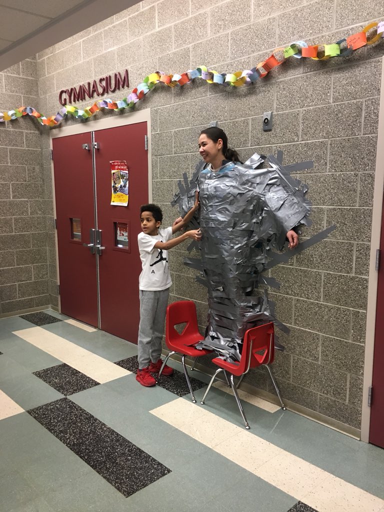 #attendancematters @ Williwaw.  Students had the best attendance for Title I schools in Jan. and they are celebrating by taping Principal McCauley to the wall.  Families + school staff = student success