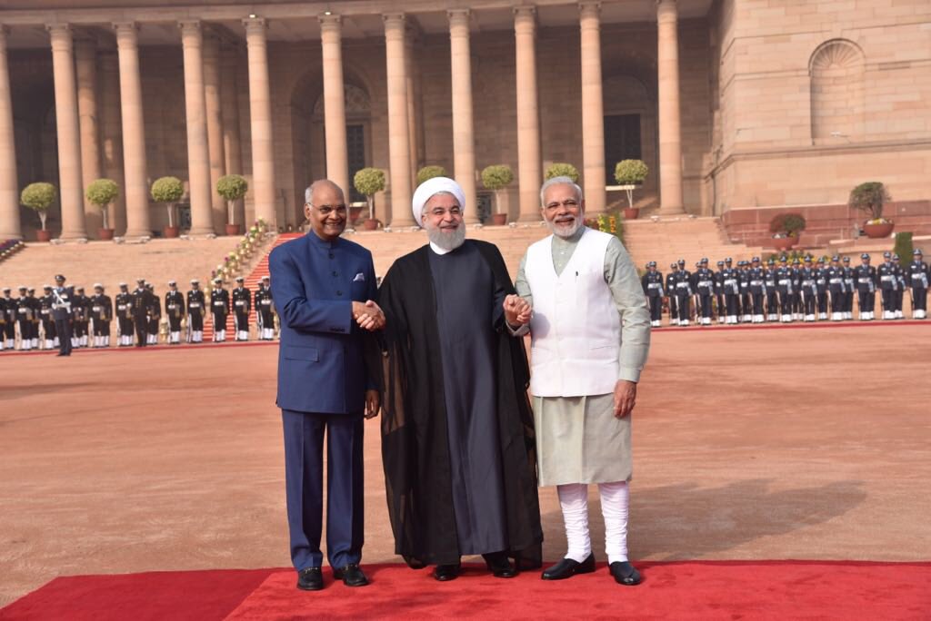 MEAIndia's tweet photo. First visit by an Iranian President in 10 years!  Ceremonial welcome accorded to President of Iran, Dr. Hassan Rouhani @rashtrapatibhvn. President Ram Nath Kovind and PM @narendramodi welcomed President Rouhani.  #DustemanIran https://t.co/OkjyIsapQ2