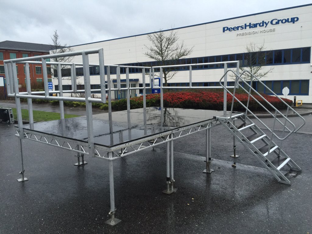 ACE_PA_HIRE's tweet photo. It’s not often we get to build a stage in the middle of the road but for this build the road was closed. 12ftx8ft Prolyte Stage for a small presentation. #stageing #prolyte #presentation #birmingham #airport https://t.co/iHilPwx60q