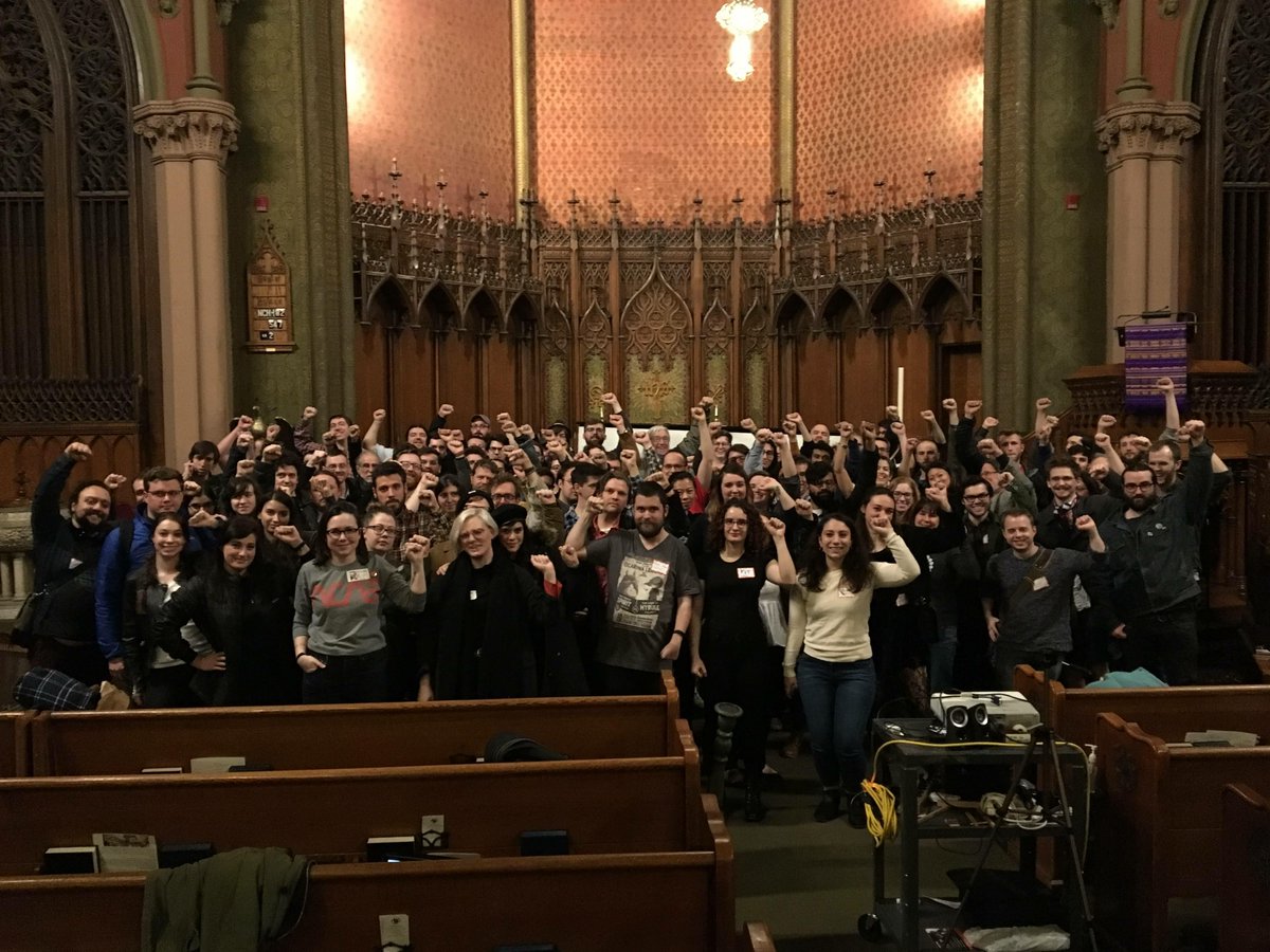 Has to be a hundred Boston DSA members in a church, fists raised, standing in solidarity