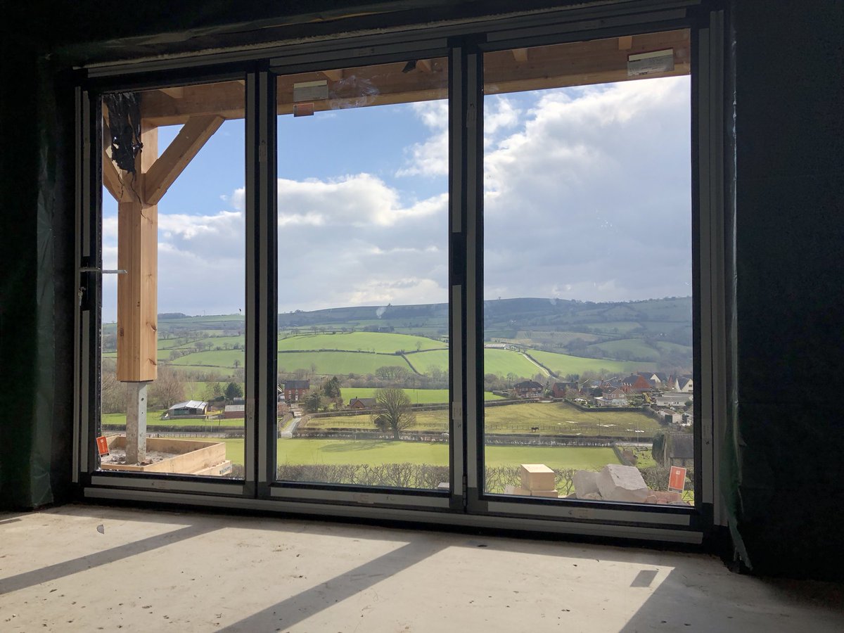 Beautiful new build with stunning views. Mixture of cream foiled PVC and aluminum powder coated multi folding doors