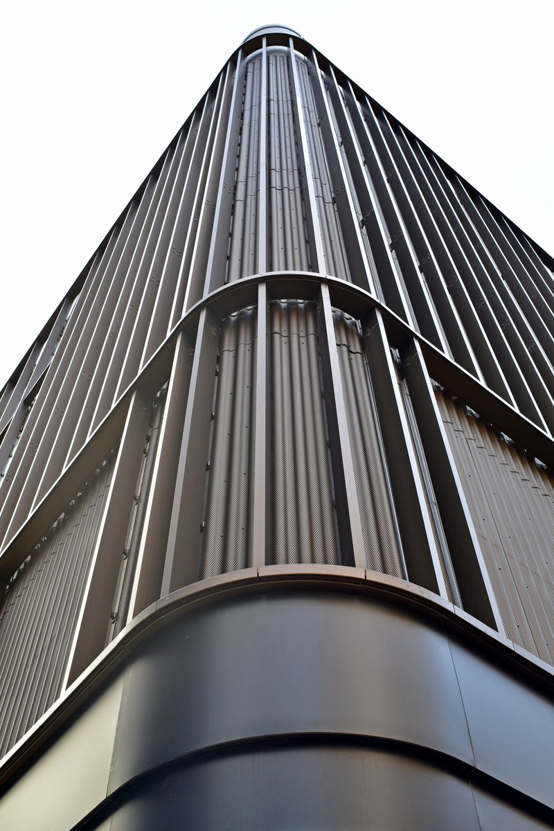 Bronze Anodised sinusoidal perforated #rainscreencladding at The Aperture building Greenwich completed by <a href="/Conttego1/">Conttego</a> and AFSI