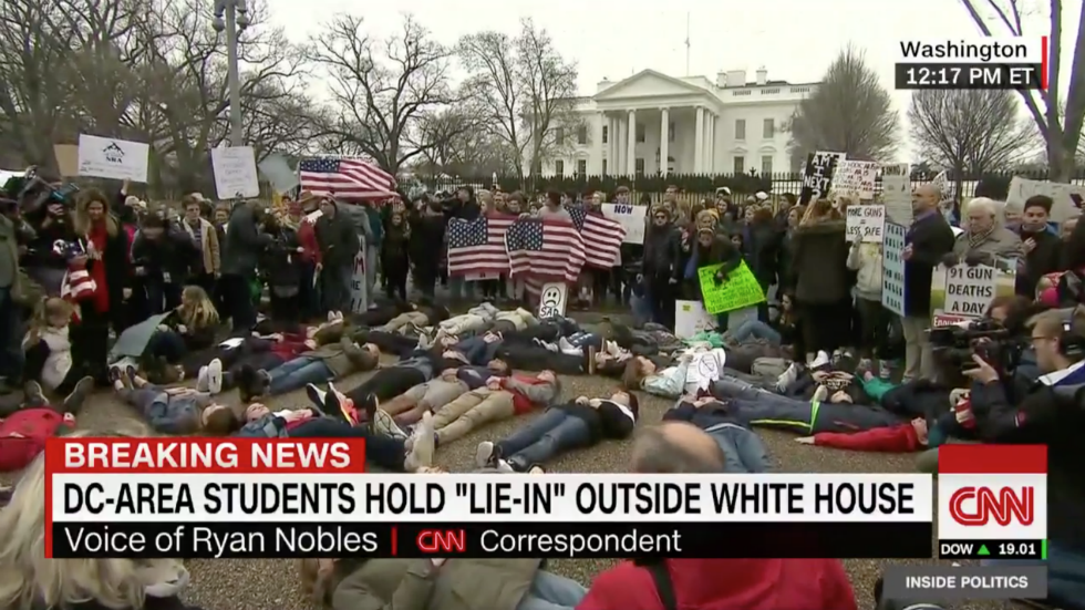thehill's tweet photo. #BREAKING: Students stage "lie-in" protest outside White House to demand action on gun control after Florida shooting https://t.co/BESqXSHRGz https://t.co/m3vkkAza7b
