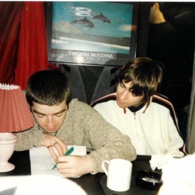 OasisActivities's tweet photo. Noel writing on his diary, Liam is there too. (1994) #NewProfilePic https://t.co/NSV0ltPfHx