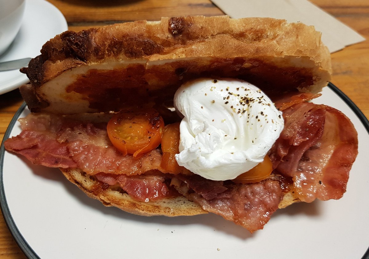 BrumTum1's tweet photo. They call it a 'posh bacon sandwich' and today I had a poached egg to go along with it. It was good... very goooood! Thank you @SpringEspresso #bacon #breakfast #poachedegg #mmmmm #springespresso #york https://t.co/rWMFKUOVmr