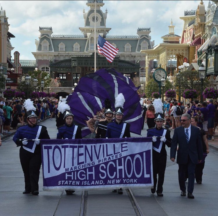 RoTierno's tweet photo. How ‘bout this pic?  @TottenvilleMB making their way down Main Street USA in Disney!! We are so proud!! Enjoy the sun...and the mouse!! 💜☀️#marchingPirates #DisneyWorld   #weknowthemouseincharge 🐭@TottenvilleSO18 @THSSTEAM @lauriedamico @SIBFSC @cbloom14 📷@jaycescraps https://t.co/nBLTHJXRJ8