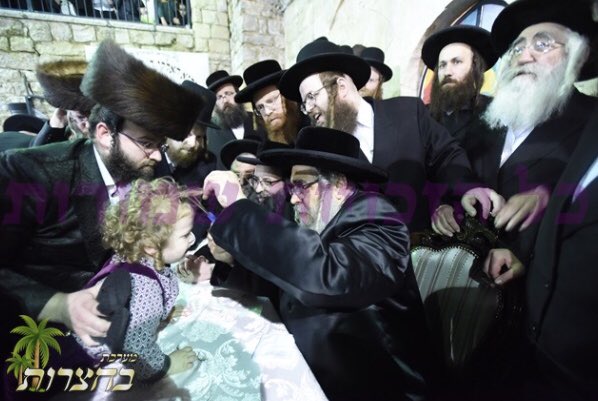 HQSatmar's tweet photo. Satmar Grand Rebbe Aron giving to 3 year olds #Chalaka kids their 1st haircut in #Meron #SatmarMeron #Galilee at the #Hadlukah bonfire at tomb of the holy sage Rabbi Shimon bar Yochai https://t.co/kSf6MBnFog