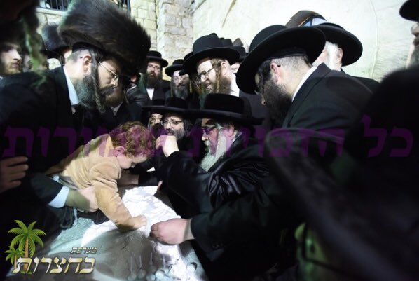 HQSatmar's tweet photo. Satmar Grand Rebbe Aron giving to 3 year olds #Chalaka kids their 1st haircut in #Meron #SatmarMeron #Galilee at the #Hadlukah bonfire at tomb of the holy sage Rabbi Shimon bar Yochai https://t.co/kSf6MBnFog